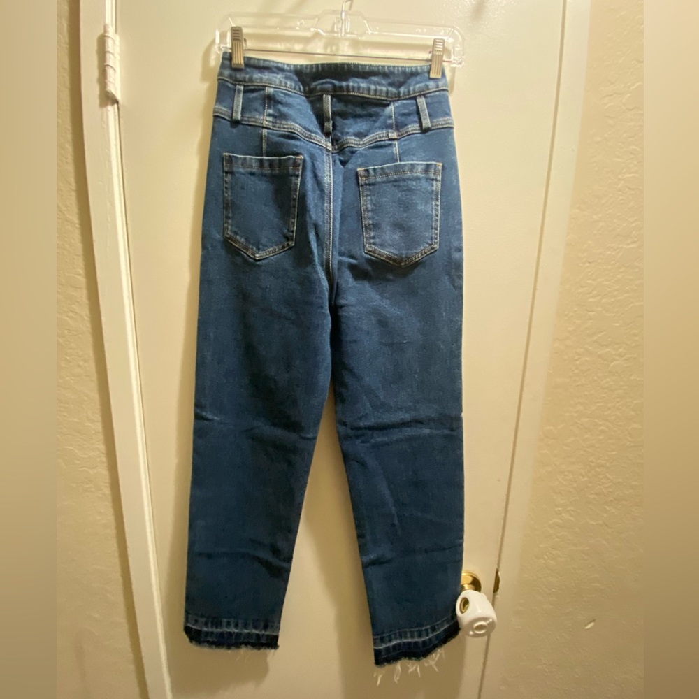 Blue jeans bottom fringe